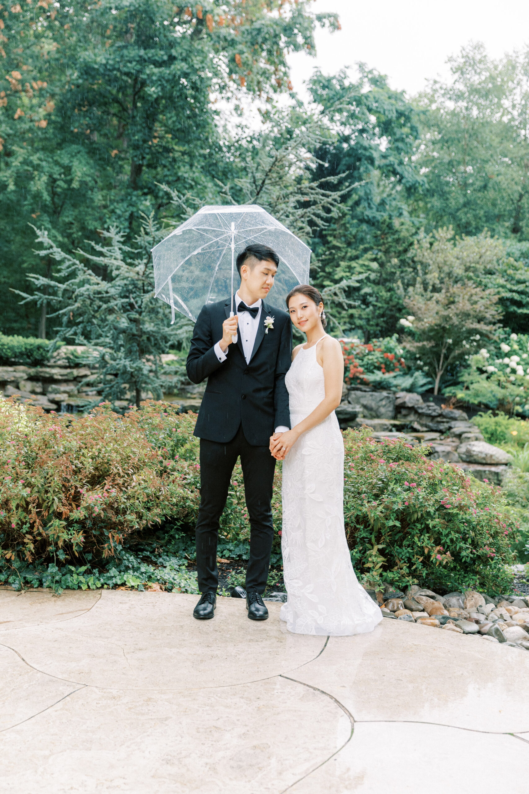 A married couple in rain by Rachel Jordan Photography