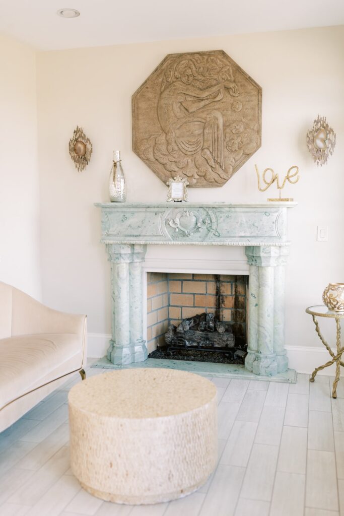 A stunning stone fire place that matches the decor of the ladies suite perfectly