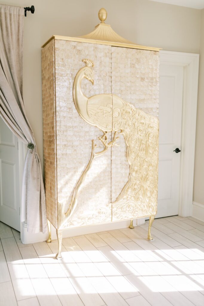 The bridal suite has an immaculate wardrobe with a gold detailed peacock